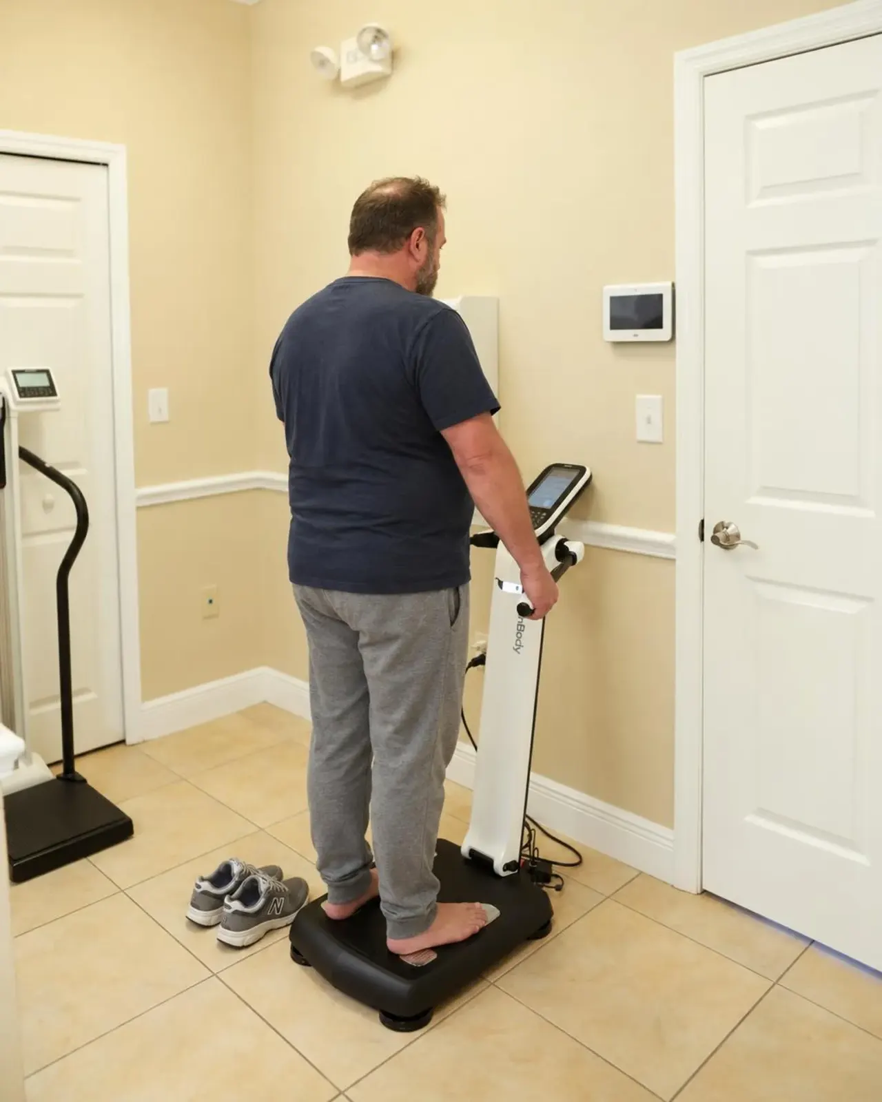 Clinician reviewing BMI, waist measurement and lab results with a patient at Advanced Optimal Healthcare in Lutz, FL